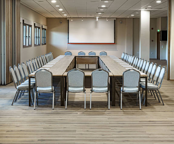 Ilis Congress Center Peloponnese Greece small conference room with squared table and a projector